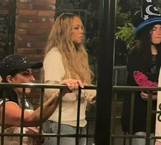 Mariah Carey waiting in line at Disney | mcarchives.com