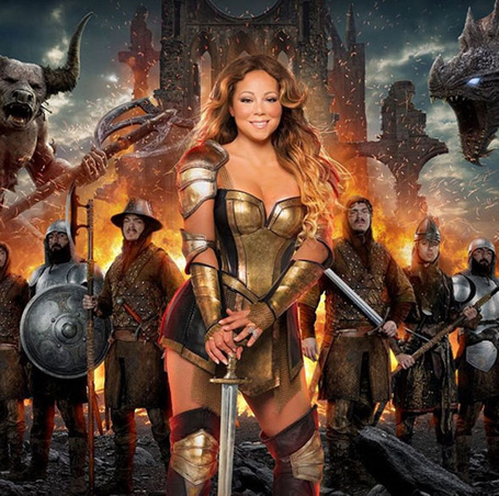 Mariah Carey flaunts plenty of cleavage in gold armour | mcarchives.com